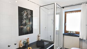 Shower, hair dryer, towels, soap