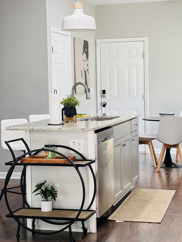 Enjoy meals in the adjacent dining area with a table and chair.
