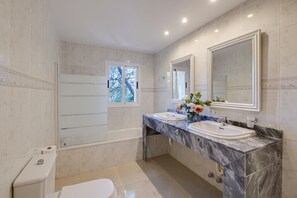 Combined shower/tub, hair dryer, towels, soap