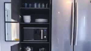 Coffee/tea maker, fridge, microwave, oven