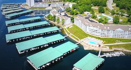 Beautiful lake front condo in perfect location by land and water. Boat Slip.