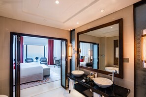 Designer toiletries, hair dryer, bathrobes, slippers