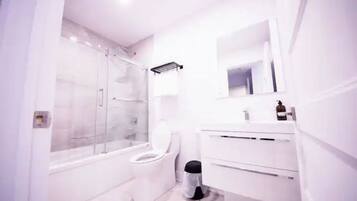 Combined shower/bathtub, hair dryer, towels, soap