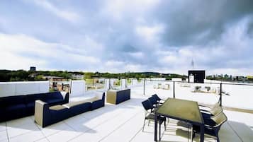 Relax on the rooftop with a sofa set and enjoy the city views.