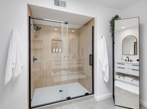 Shower, hair dryer, towels, toilet paper