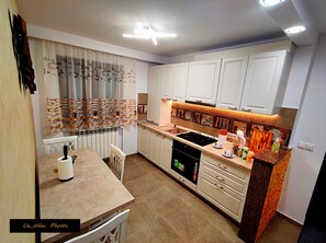 Fridge, stovetop, electric kettle, toaster