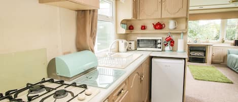 Fridge, electric kettle, toaster, cookware/dishes/utensils