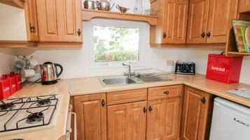 Fridge, electric kettle, toaster, cookware/dishes/utensils