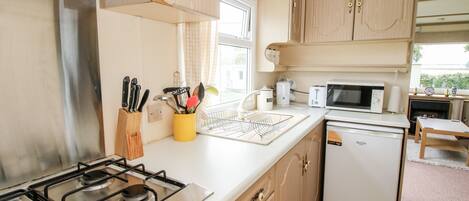 Fridge, electric kettle, toaster, cookware/dishes/utensils