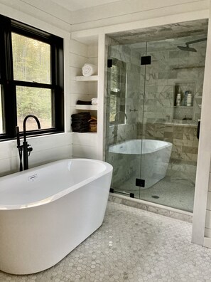 Bathtub, hair dryer, towels, soap