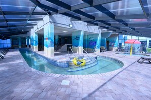 Relax by the pool surrounded by vibrant marine life murals and enjoy a refreshing swim.