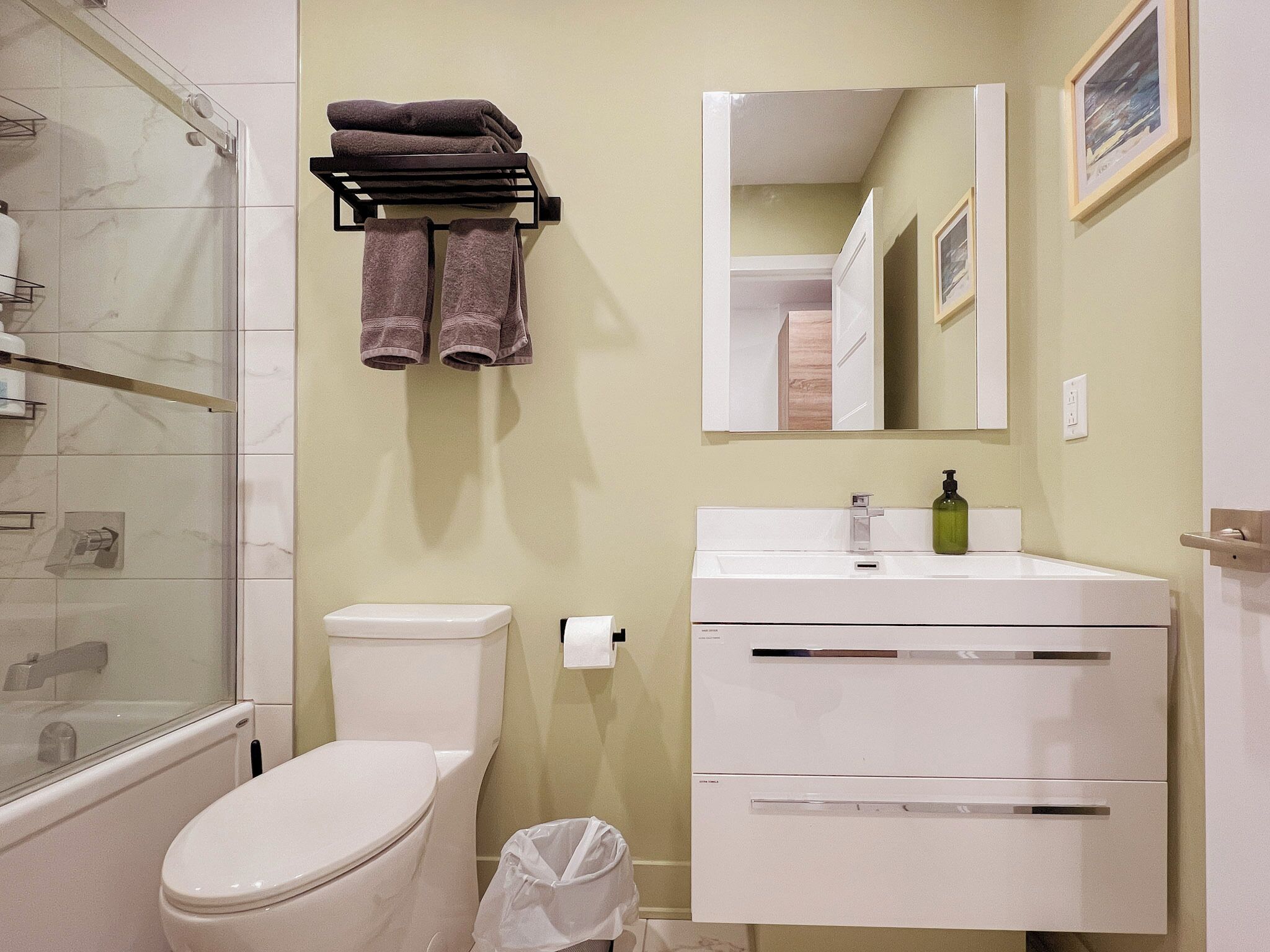 Combined shower/tub, hair dryer, towels, soap