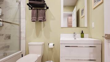 Combined shower/tub, hair dryer, towels, soap