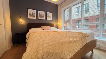 1 bedroom, desk, iron/ironing board, travel crib