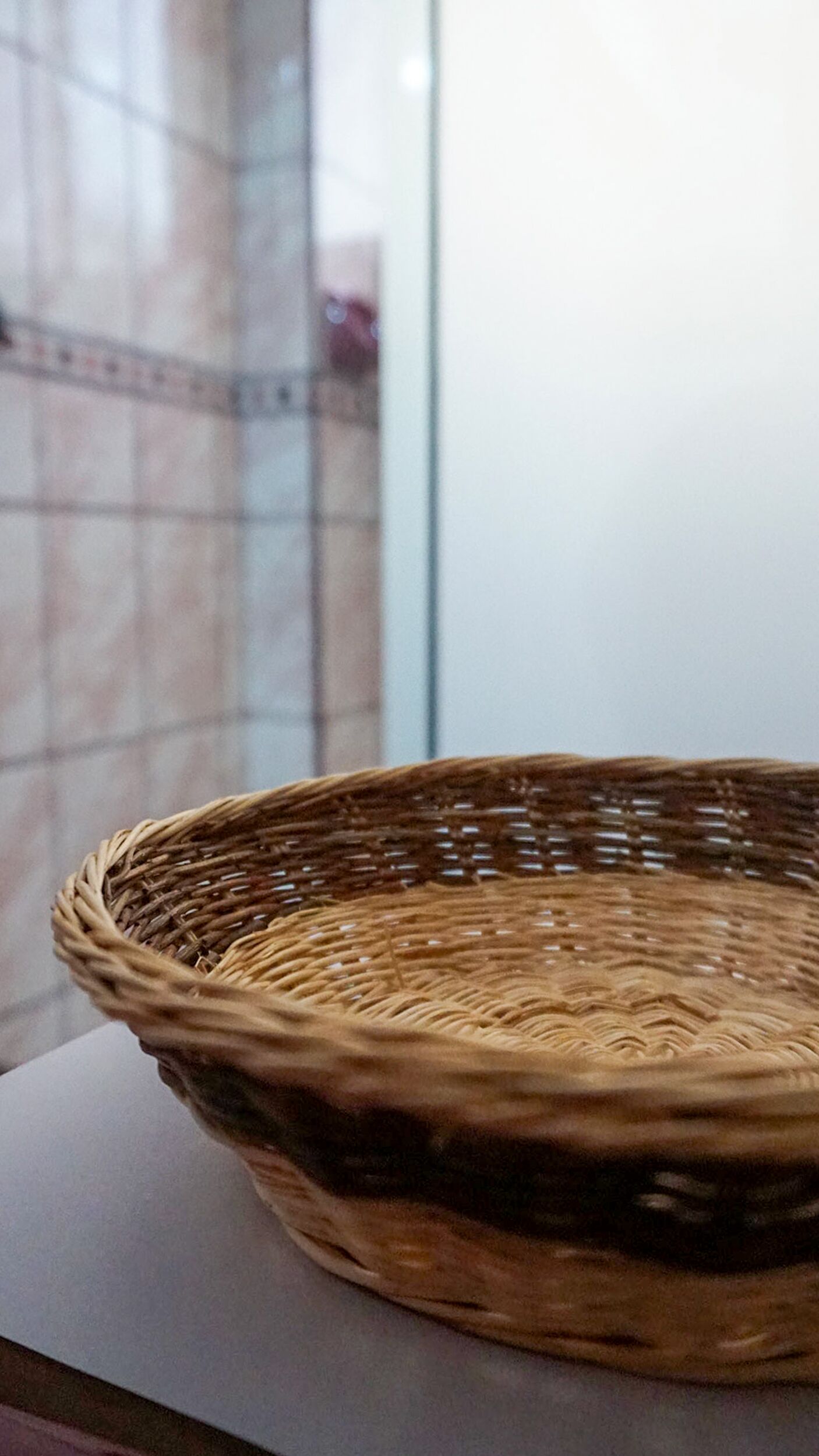 A wicker basket on a table.