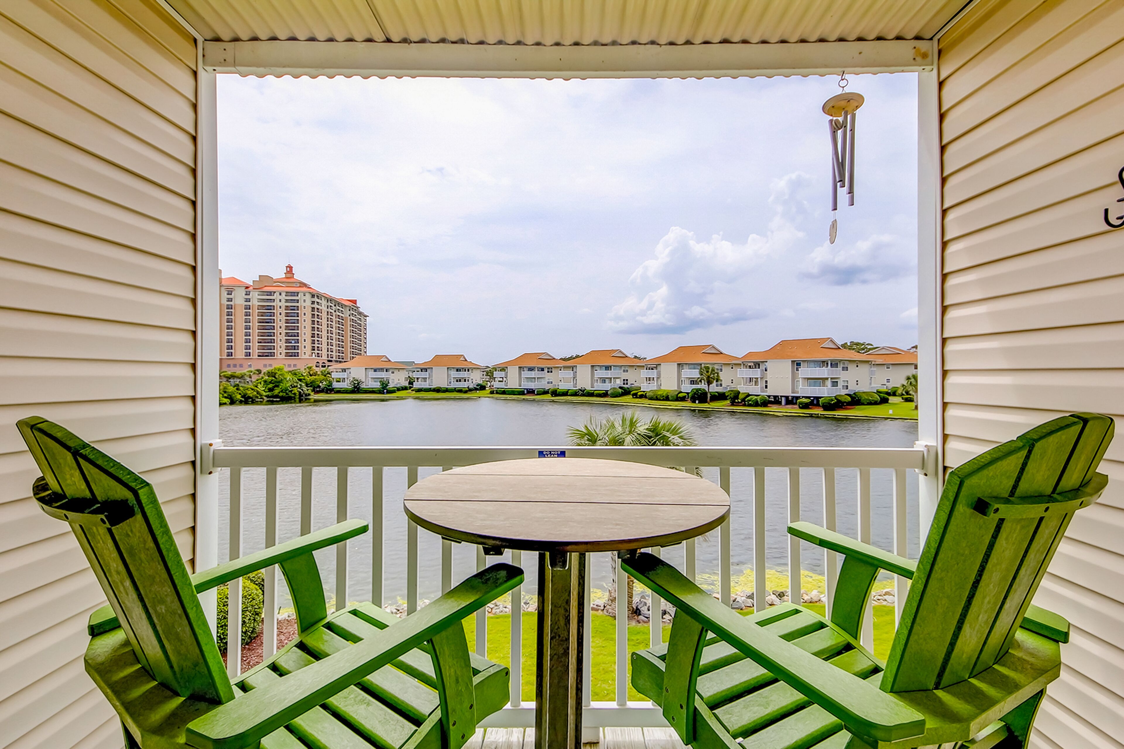 Lakefront condo with balcony, pool & sunset views - 2 blocks to the beach