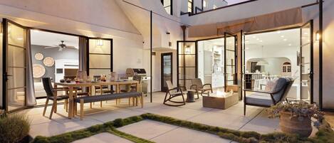 A modern house with an open-plan kitchen, dining area, and living space.