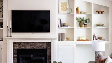 55-inch TV with digital channels, fireplace, streaming services