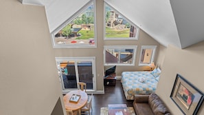 A bedroom with a large window, a bed, a desk, and a view of the outdoors. - Blue Mesa 2 Unit Buyout by Avantstay 2 Units Centrally Located Ski In/ Ski Out Unit! (Telluride)