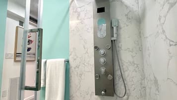 Shower, eco-friendly toiletries, hair dryer, towels