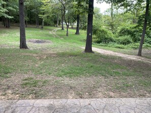 A park with a dirt path, trees, and grassy areas. - Waterfront with Sandy Shores! (Eufaula)
