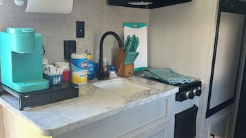 Fridge, microwave, stovetop, coffee/tea maker