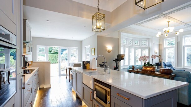 A spacious kitchen with a large island, modern appliances, and a view to the outdoors. - Tranquil Apartment in Merseyside (Liverpool)