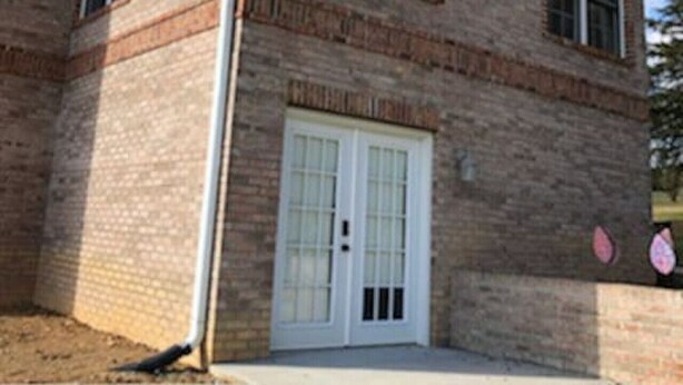 A two-story brick building with arched windows and a central door. - Spacious Unit with Mountain View on Route 11 (New Market)