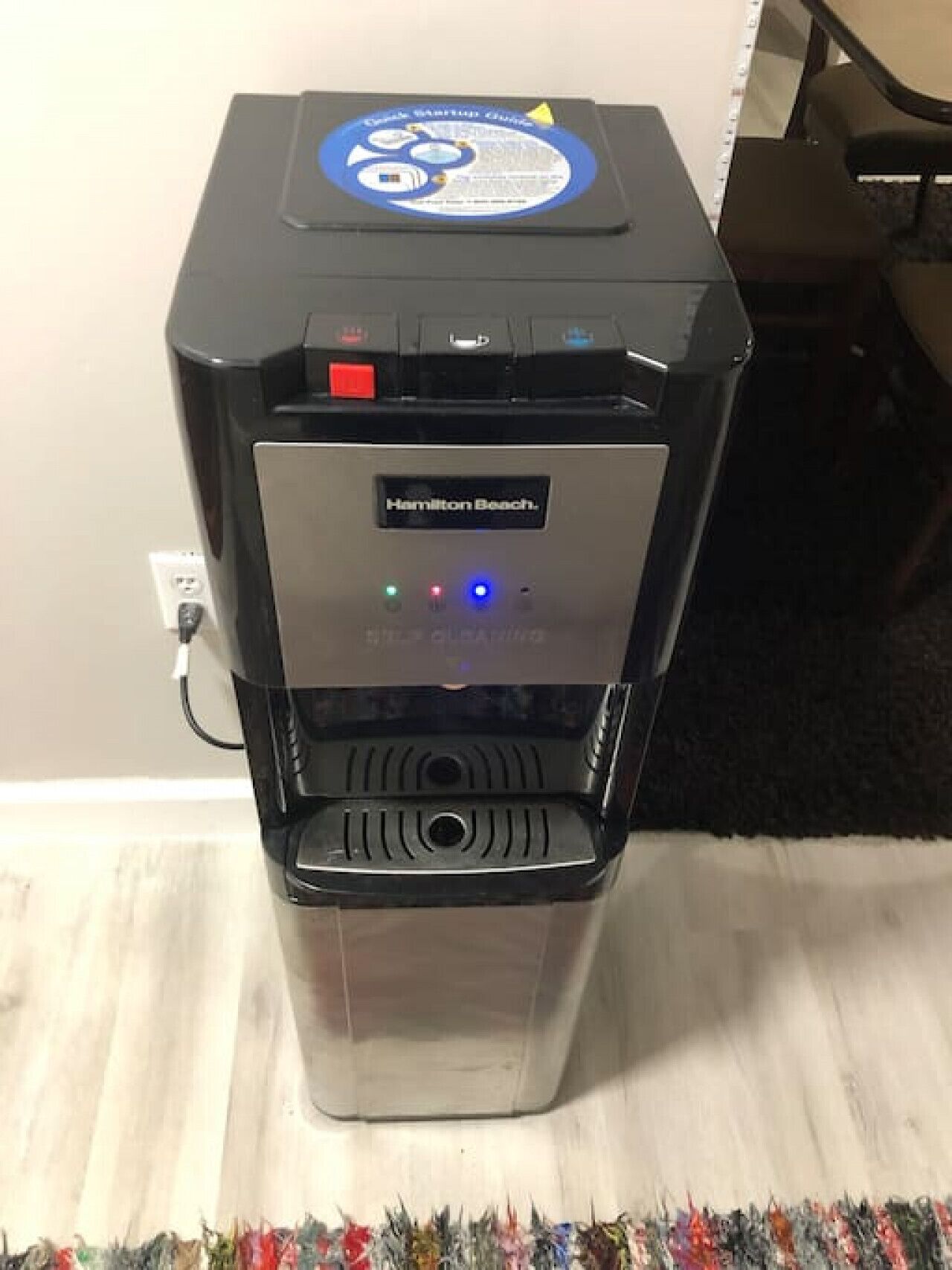 A Hamilton Beach water dispenser with a digital display and multiple water dispensing options.