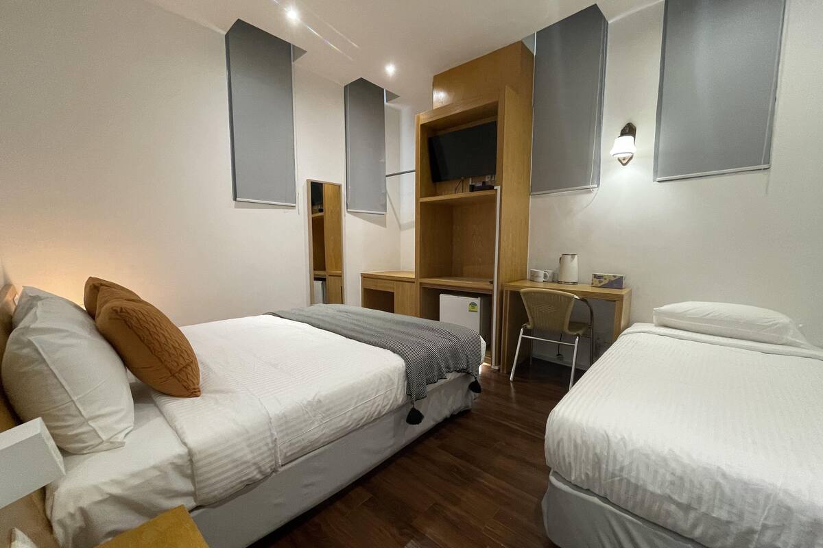 Family Triple Room | Iron/ironing board, WiFi (free), bed sheets
