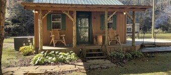 Peaceful cabin in secluded mountain spot beside a picturesque creek