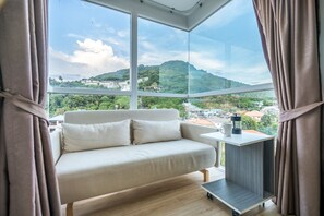 City Studio, Mountain View | Living area | Flat-screen TV - Ozone Condo by Lofty (Karon)