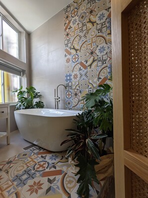 Bathtub, hair dryer, towels, soap