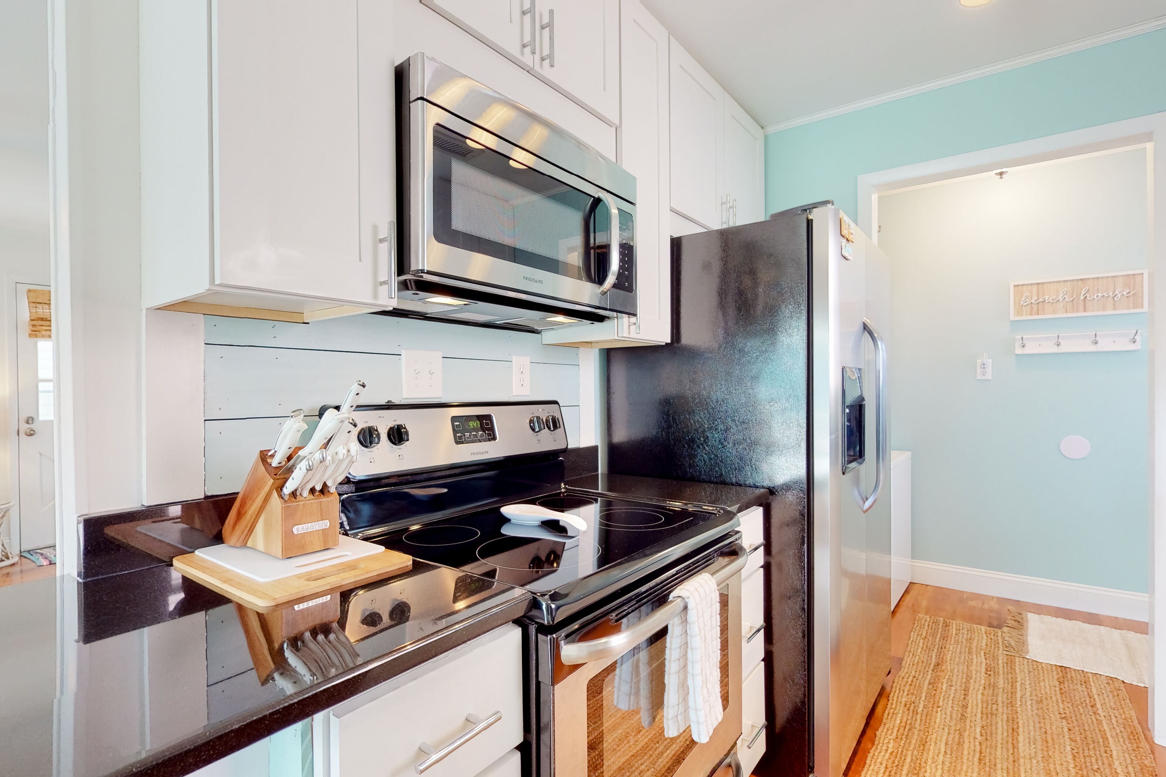 Canal-front home on Holden Beach with dock, deck & beach gear - dog-friendly