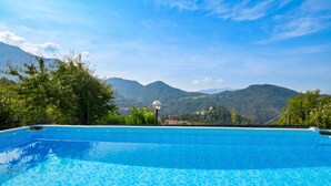 A swimming pool with a mountain view. - Casa Busso, Esino Lario, Italy (Esino Lario)