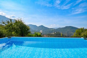 A swimming pool with a mountain view. - Casa Busso, Esino Lario, Italy (Esino Lario)