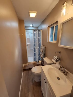 Shower, towels, soap, toilet paper