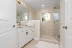 Shower, hair dryer, towels, shampoo