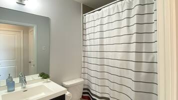 Combined shower/tub, hair dryer, towels, soap