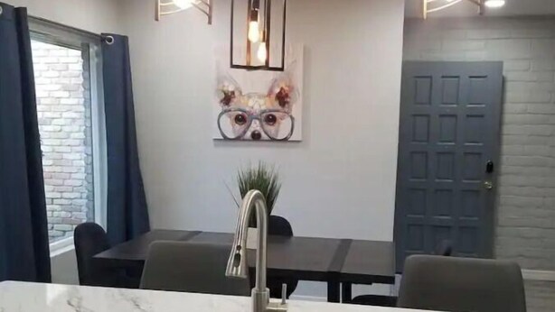 A modern kitchen with a marble countertop, stainless steel sink, and pendant lighting. - Eastside 3 bed 2 bath, King en suite & fast Wifi (El Paso)