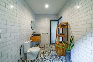 Separate bathtub and shower, hair dryer, towels, soap
