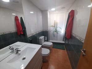 Bathtub, bidet, towels, soap