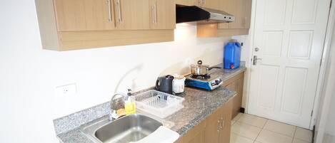 Fridge, microwave, electric kettle, cookware/dishes/utensils