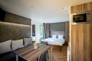 Luxury Bungalow | Premium bedding, down comforters, laptop workspace, blackout drapes