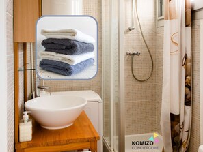 Shower, hair dryer, towels