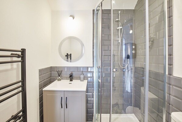 Shower, hair dryer, towels, soap