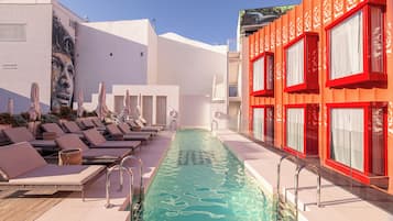 Seasonal outdoor pool, open noon to 8:00 PM, pool umbrellas