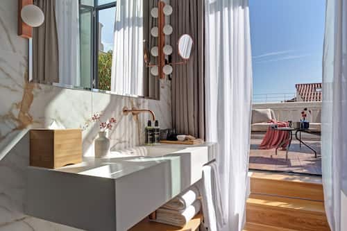 Separate bathtub and shower, rainfall showerhead, hair dryer, bathrobes