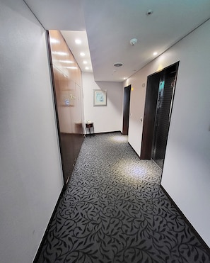 Leading to an entrance with a glass panel.