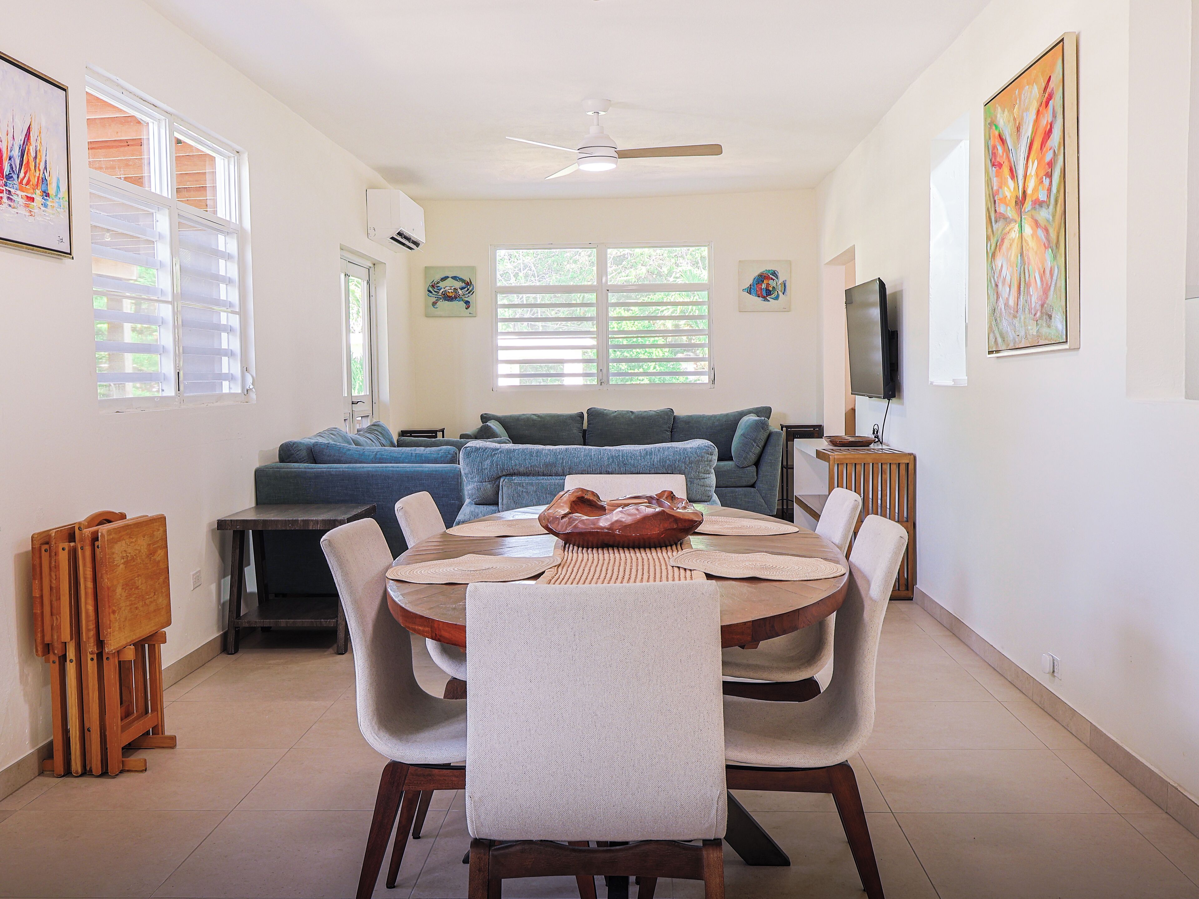 Main dining area view from between laundry and bathroom three doors.